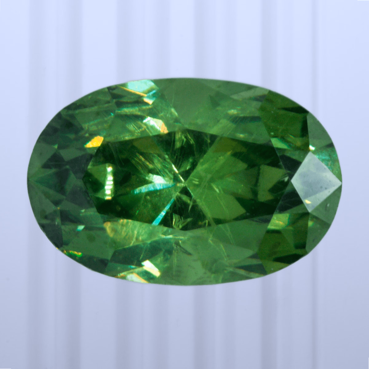 1.08 ct Demantoid, Russia, Unheated/Untreated, Oval Cut, photo 1 of 4