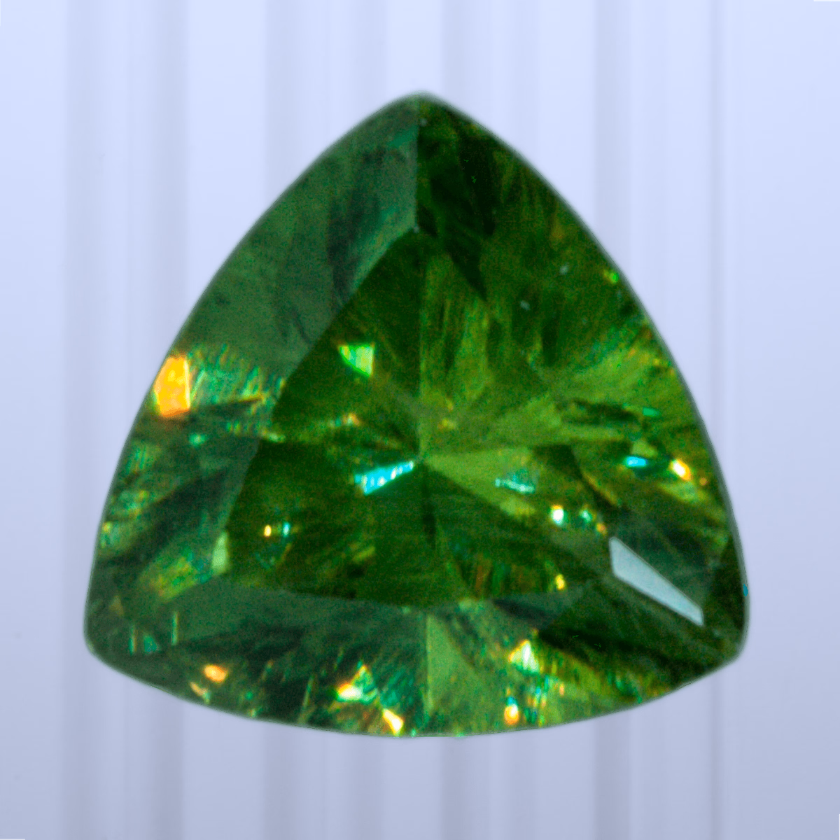 0.46 ct Demantoid, Russia, Unheated/Untreated, Trillion Cut, photo 1 of 4
