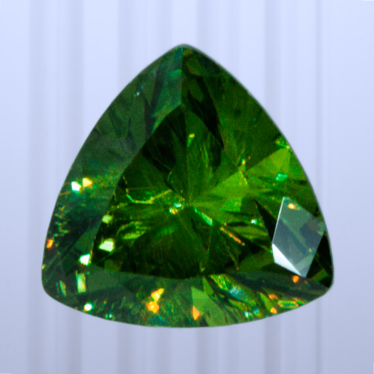0.85 ct Demantoid, Russia, Unheated/Untreated, Trillion Cut, photo 1 of 4