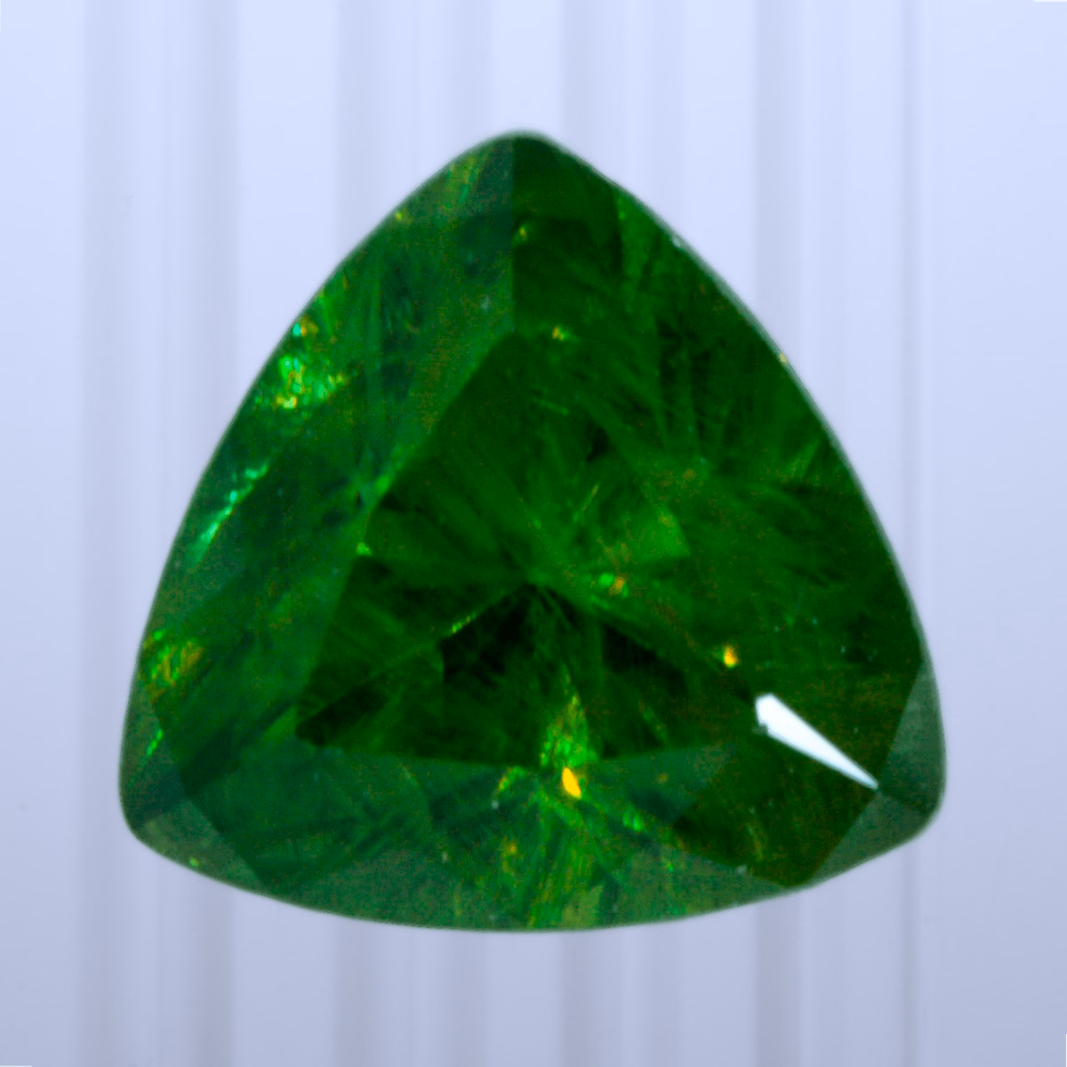 0.68 ct Demantoid, Russia, Unheated/Untreated, Trillion Cut, photo 1 of 4