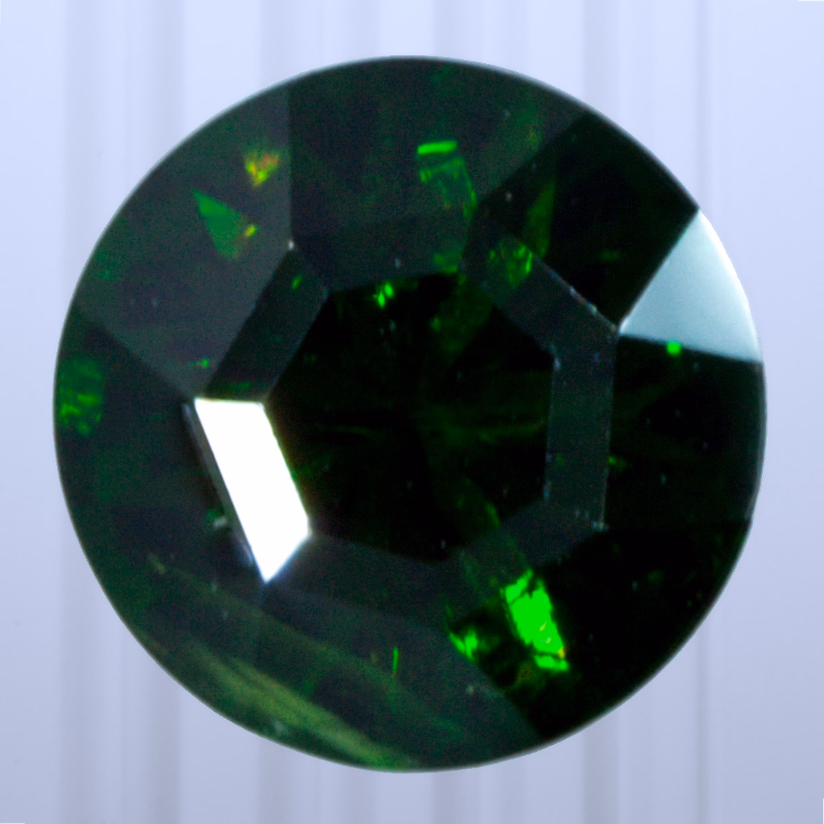 0.77 ct Demantoid, Russia, Unheated/Untreated, Round Cut, photo 1 of 4