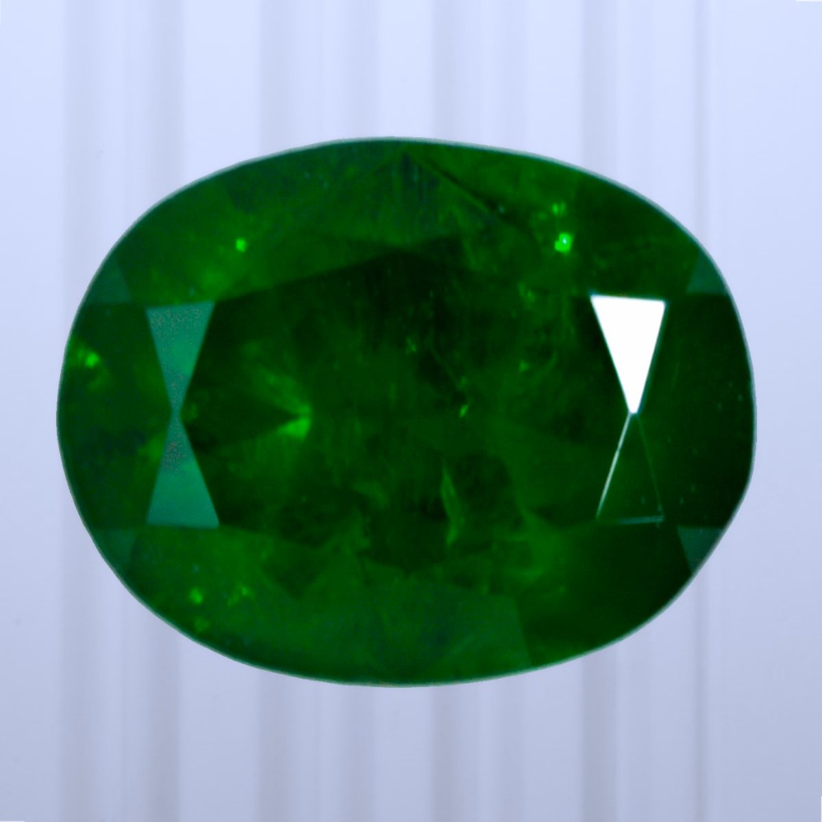 0.84 ct Demantoid, Russia, Unheated/Untreated, Oval Cut, photo 1 of 4