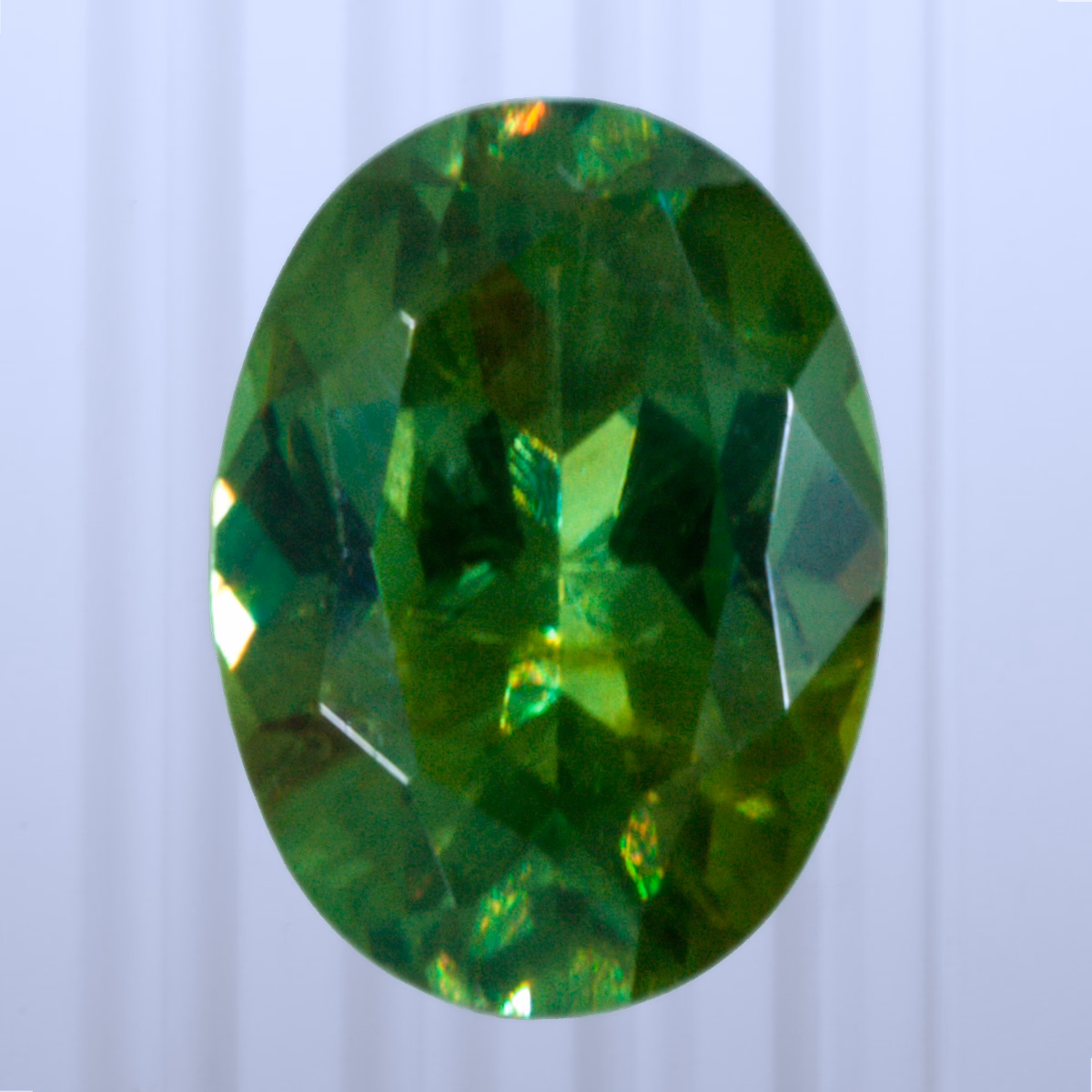 0.68 ct Demantoid, Russia, Unheated/Untreated, Oval Cut, photo 1 of 4